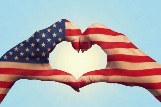 United States Of America Flag Pattern On People Hands In Heart S Hands making love gesture with US flag